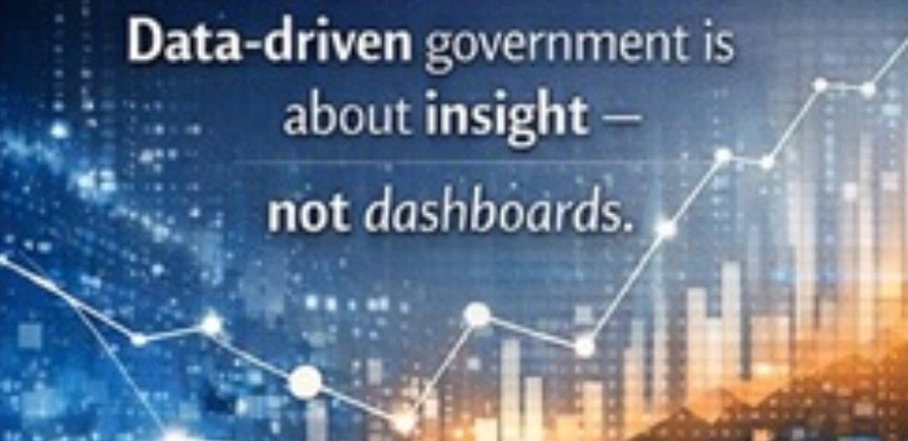 The image features the phrase 'Data-driven government is about insight — not dashboards.' overlaid on a digital background. The setting includes abstract data visualizations, such as line graphs and bar charts, with glowing points and a blue-orange palette. The visuals evoke a modern, analytical mood, emphasizing technology and government data analysis. No specific brands or numeric values are visible.